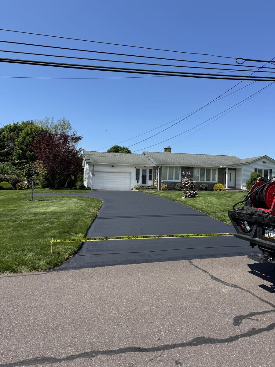 After sealcoating – freshly sealed residential driveway