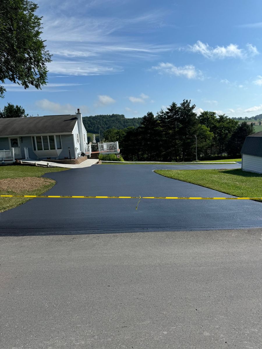 After sealcoating – like-new residential driveway with two garages