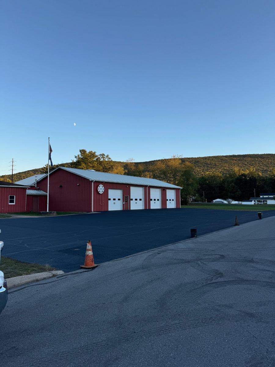 After sealcoating – freshly sealed fire station parking lot