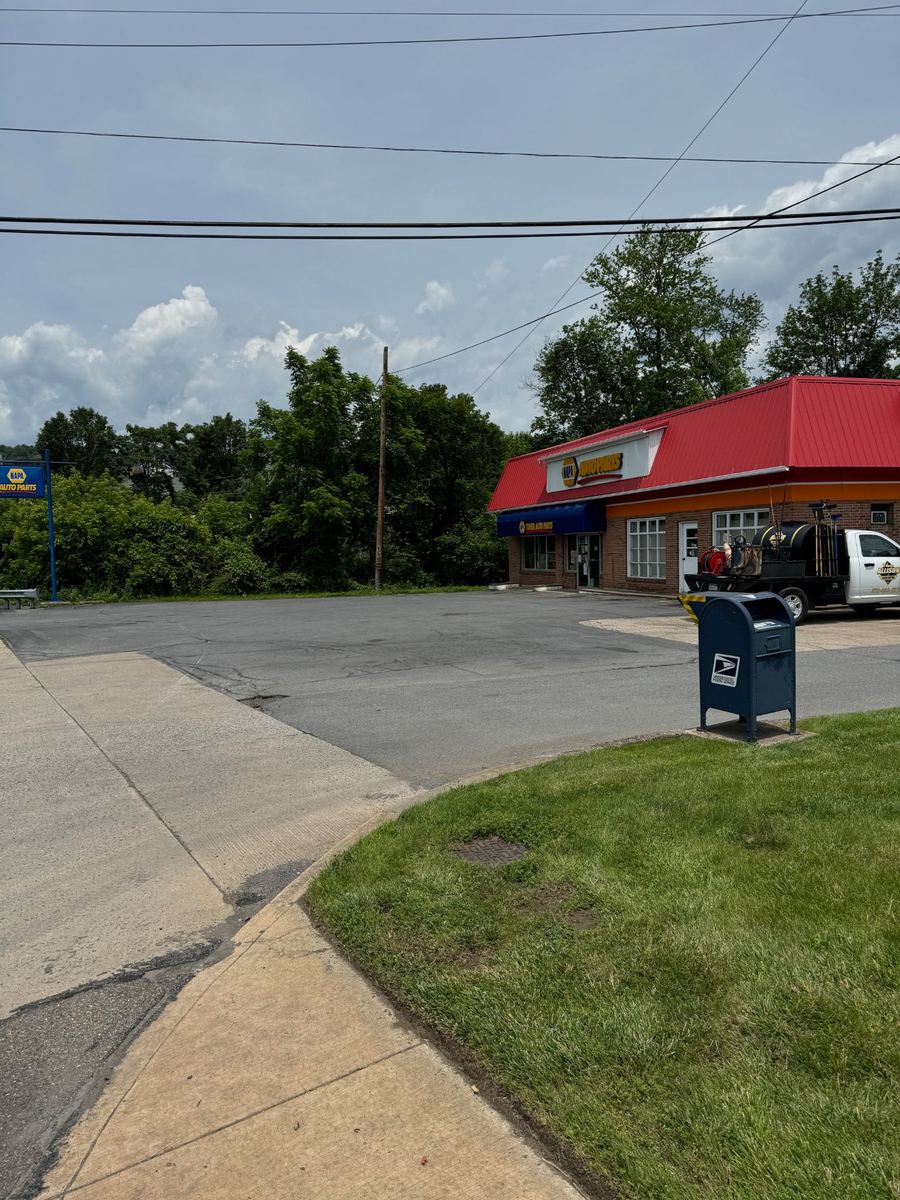 Before asphalt sealcoating – faded commercial parking lot, Central PA